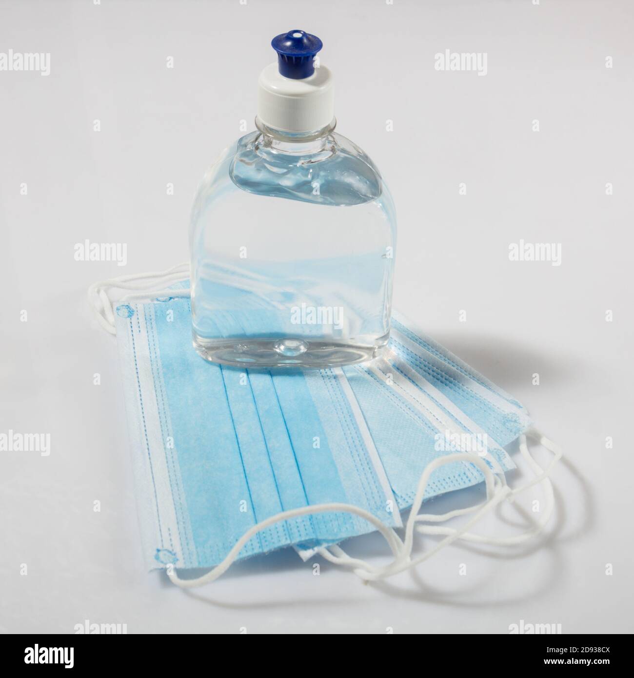 Alcohol gel hand sanitizer and disposable hygienic mask Stock Photo Alamy