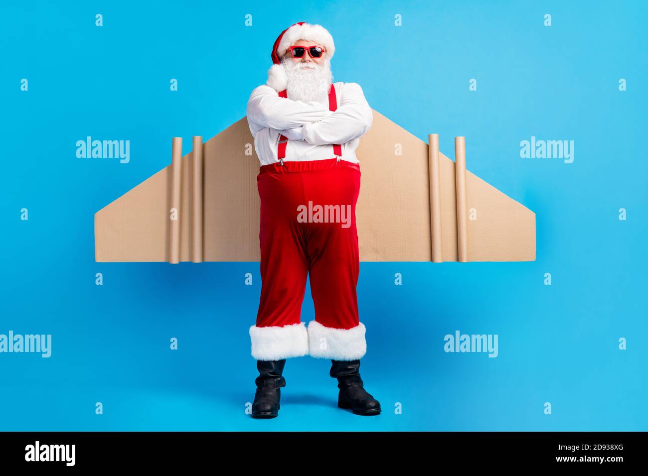 Full body photo of confident aviator white grey hair bearded santa claus  cross hands have craft wings x-mas christmas gift dream delivery wear Stock  Photo - Alamy
