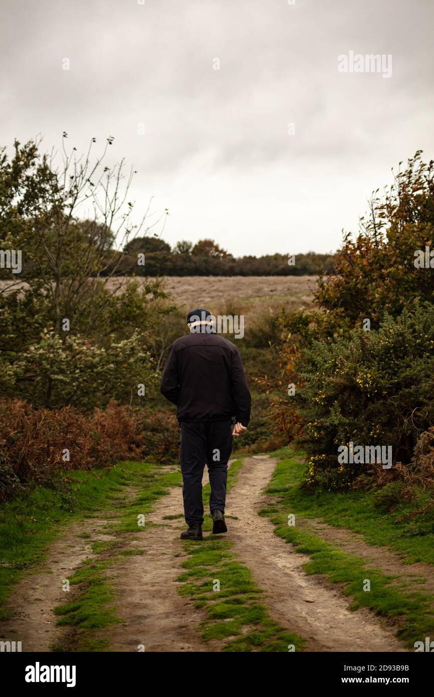 An Old Man Walking through the Firehills in Fairlight, near Hastings Stock Photo