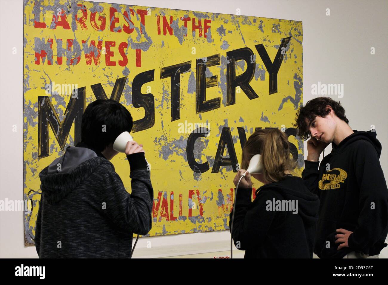 Three teens listen to information about the cave at Mystery Cave in Preston, Minnesota. Stock Photo