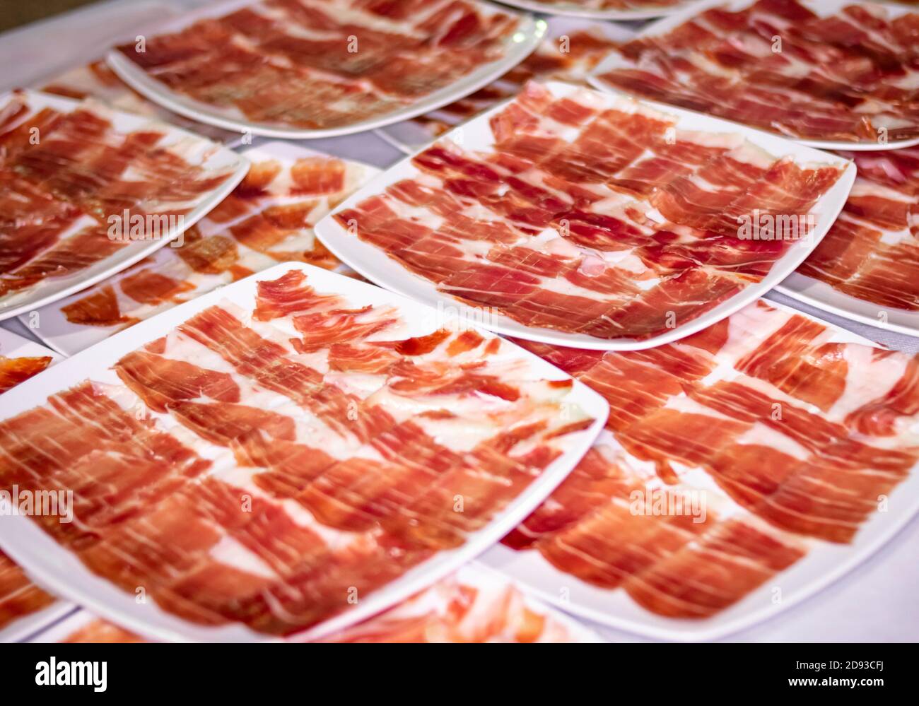 Catering service. Dishes and portions of Iberian ham and Serrano ham at a social event Stock Photo