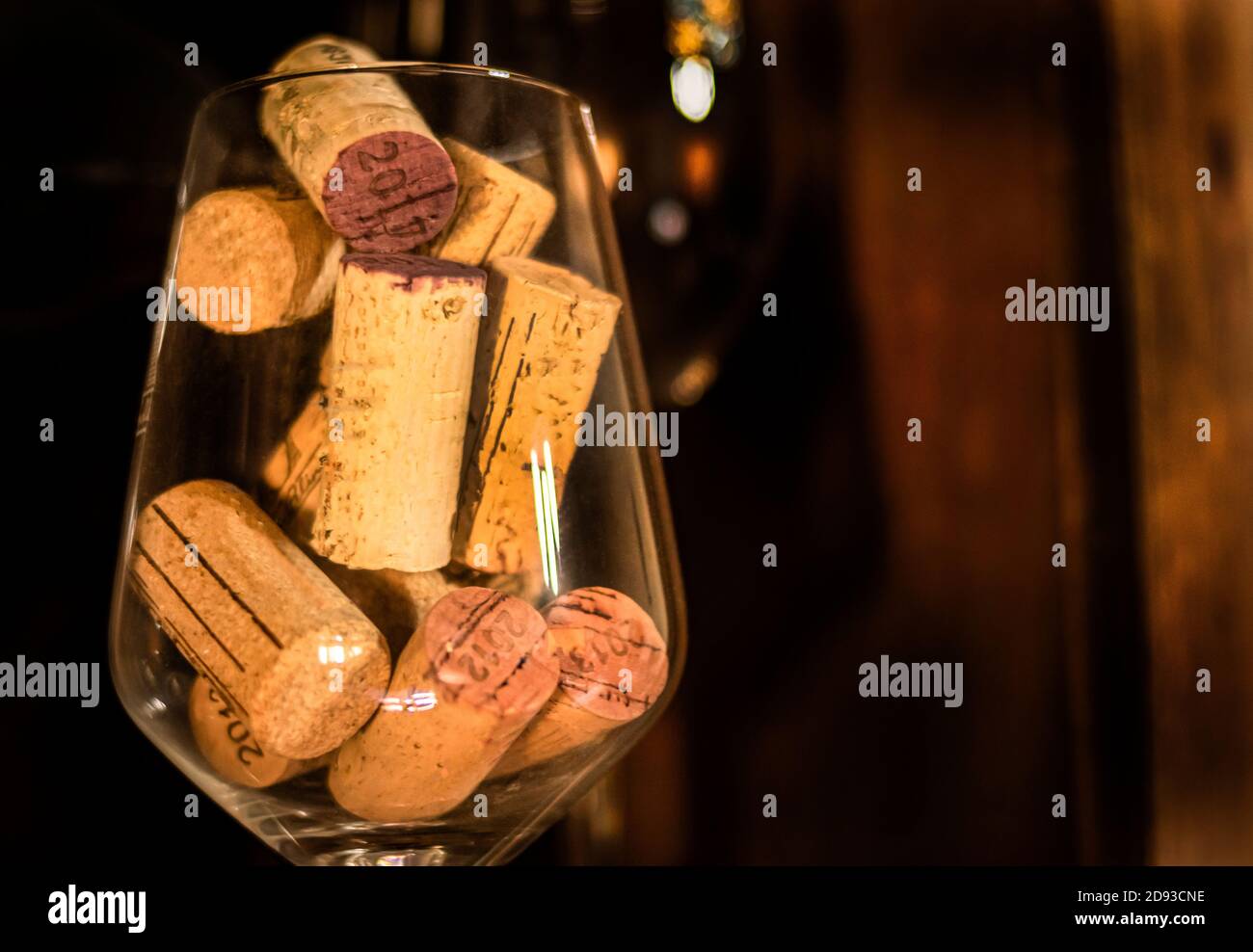 A lot of wine bottle corks inside a wine glass Stock Photo