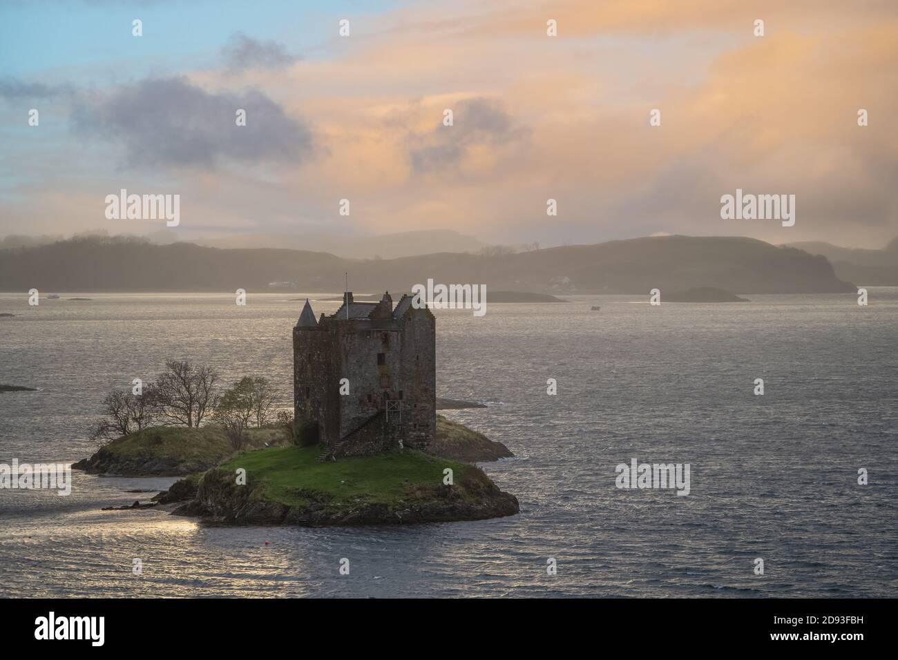 Castle Stalker,  Lynn of Lorn National Scenic Area, Appin, Scotland, UK with Lismore behind it and evening clouds above. Stock Photo
