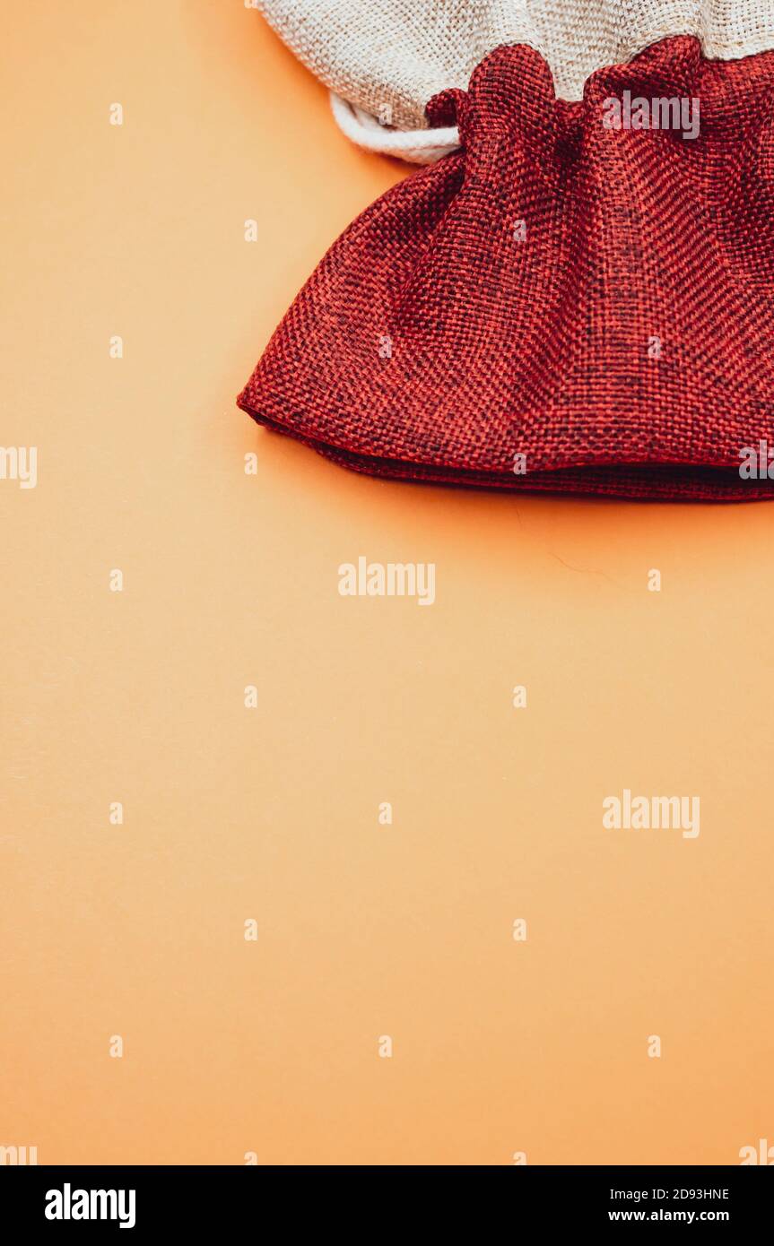 decorative rough textile sacks on an orange background Stock Photo