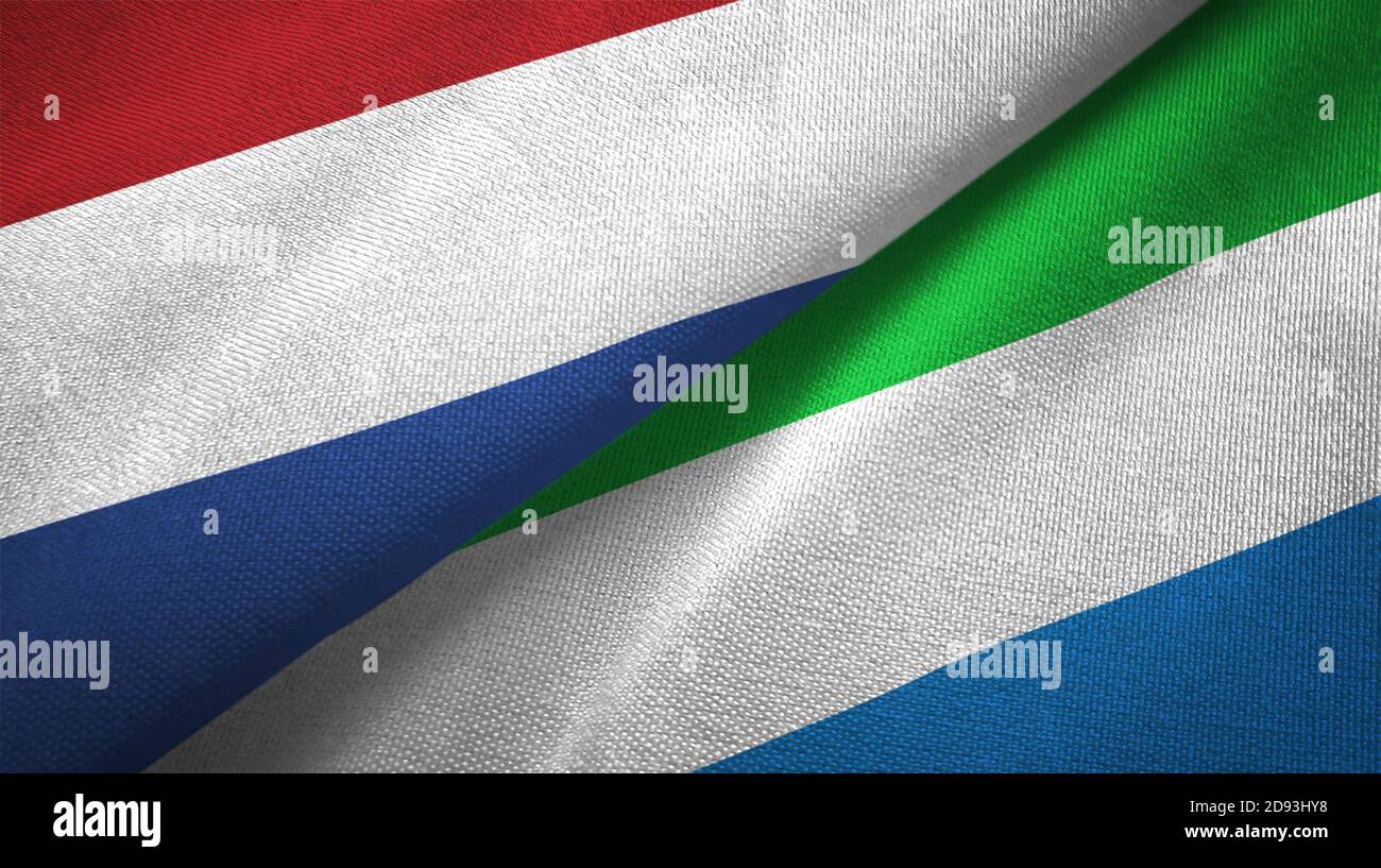 Netherlands and Sierra Leone two flags textile cloth, fabric texture Stock Photo