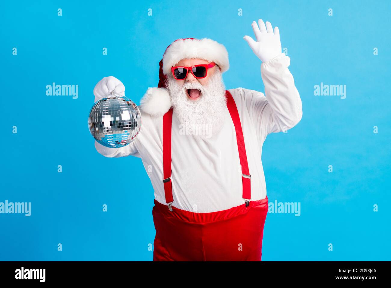 Photo of cool hipster santa claus dance x-mas christmas tradition holly  discotheque hold glitter ball wear suspenders overalls headwear cap  isolated Stock Photo - Alamy