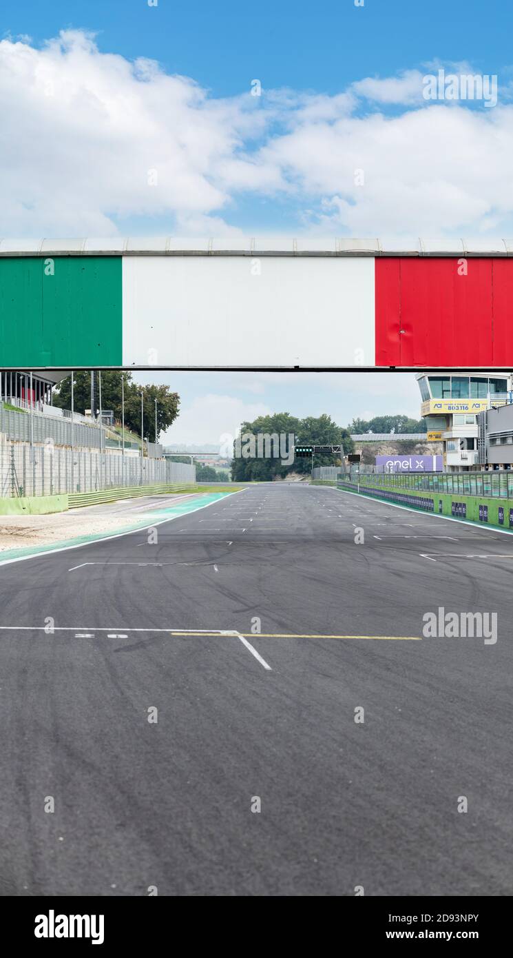 Vallelunga, Italy, 23 october 2020. Motor sport circuit asphalt track starting line rear view empty with italian flag colors bridge Stock Photo