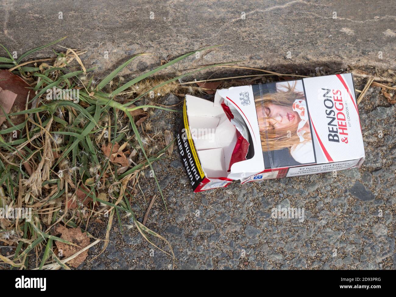 Graphic image on discarded empty packet of Benson and Hedges cigarettes. Stock Photo
