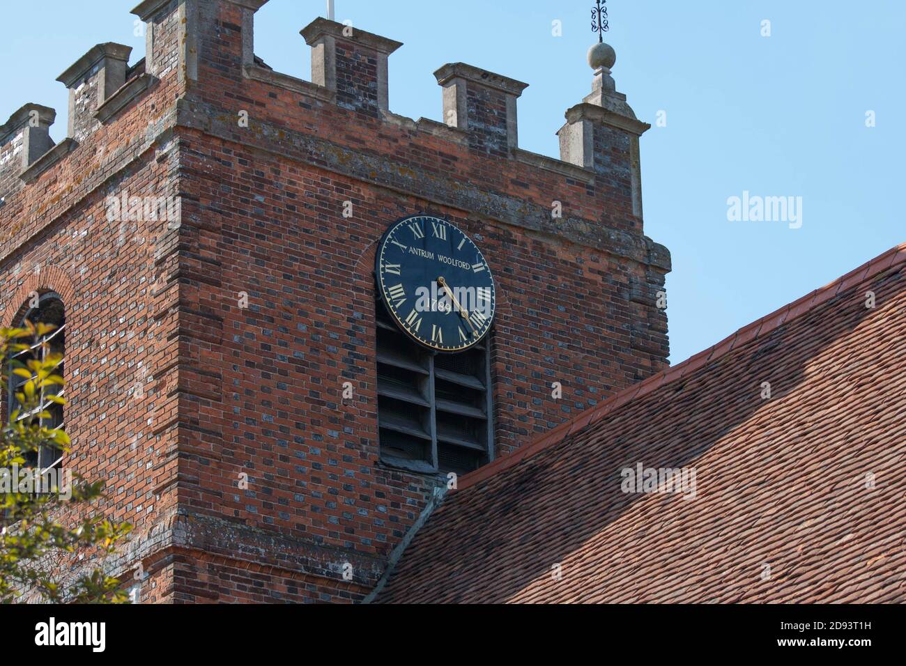 Clock tower of St James the Less, Pangbourne.  Kenneth Grahame the author of Wind in the Willows, lived in the adjacent Church Cottage. Stock Photo