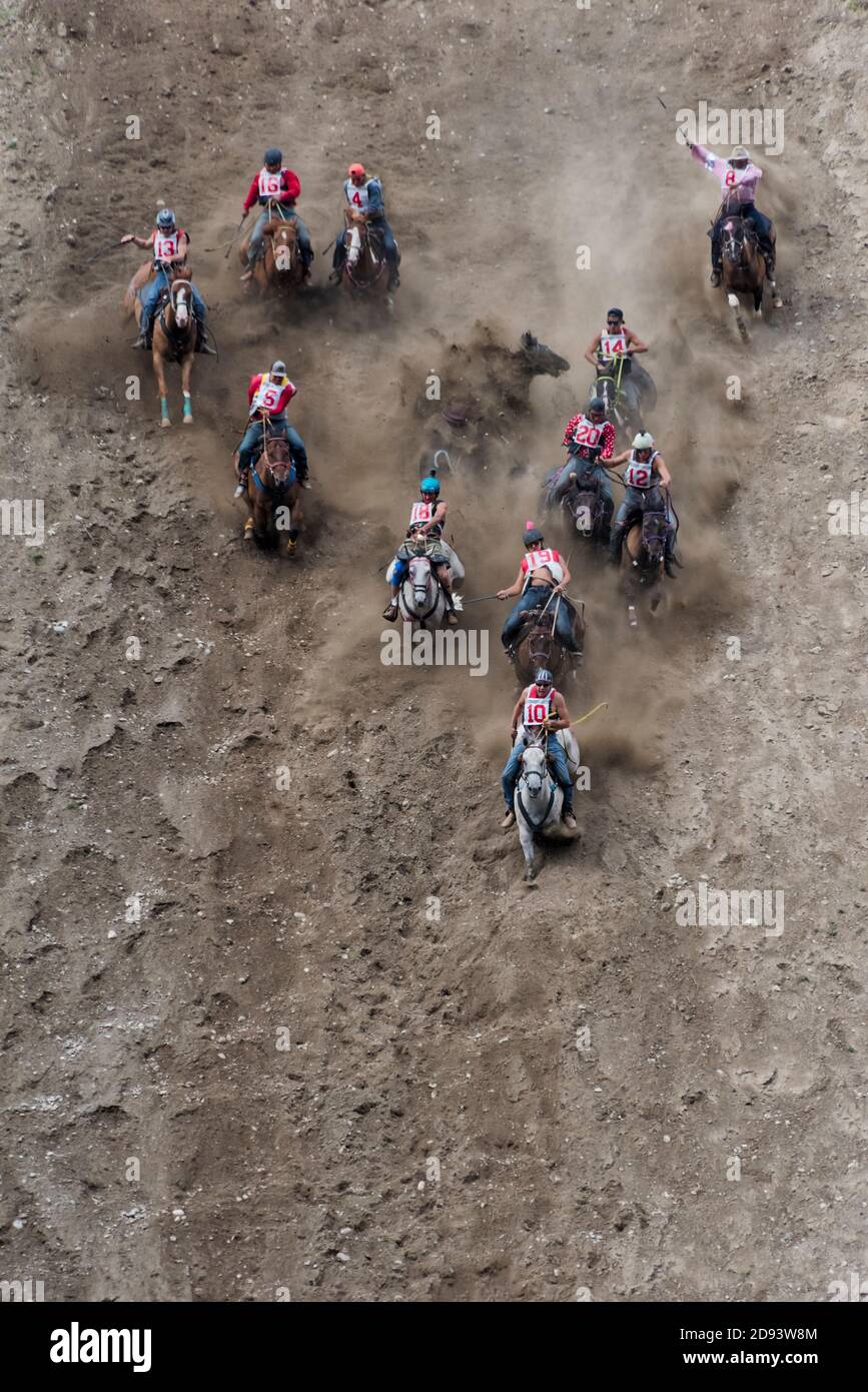 Suicide Race, cowboy riding on horse racing from the top of steep cliff to the river, Omak Stampede, Washington State, USA (Suicide Race is part of th Stock Photo