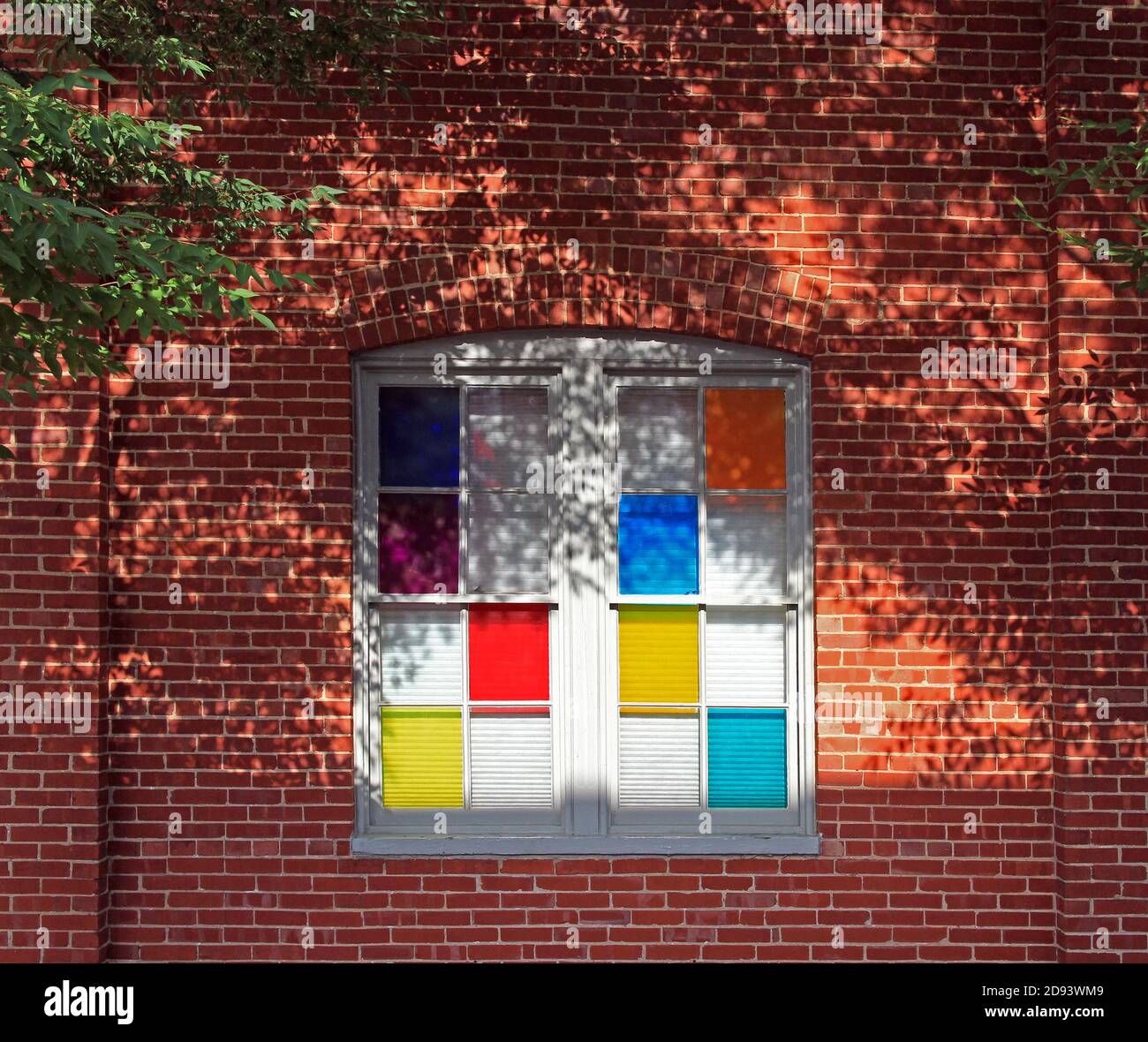 A window with colorful panes. Stock Photo