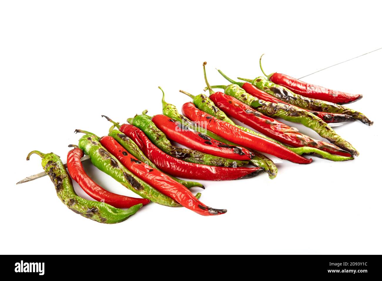 Roasting red and green hot chili peppers direct fire,A method of