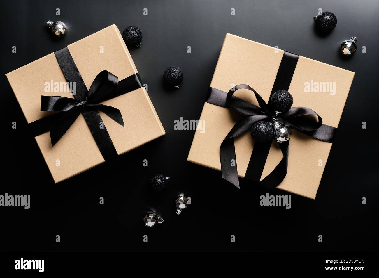 Gift box with gold coloured wrapping paper and a black ribbon and bow Stock  Photo - Alamy