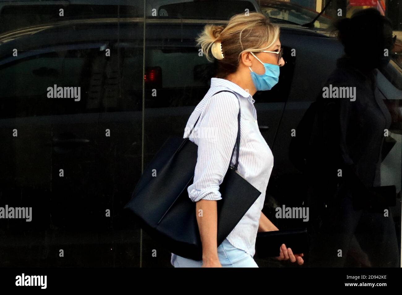 Amman, Jordan. 2nd Nov, 2020. A woman wearing a face mask walks on a street in Amman, capital of Jordan, on Nov. 2, 2020. Jordan on Monday recorded 5,877 new coronavirus cases, the highest daily spike in the country so far, raising the tally to 81,743. Credit: Mohammad Abu Ghosh/Xinhua/Alamy Live News Stock Photo