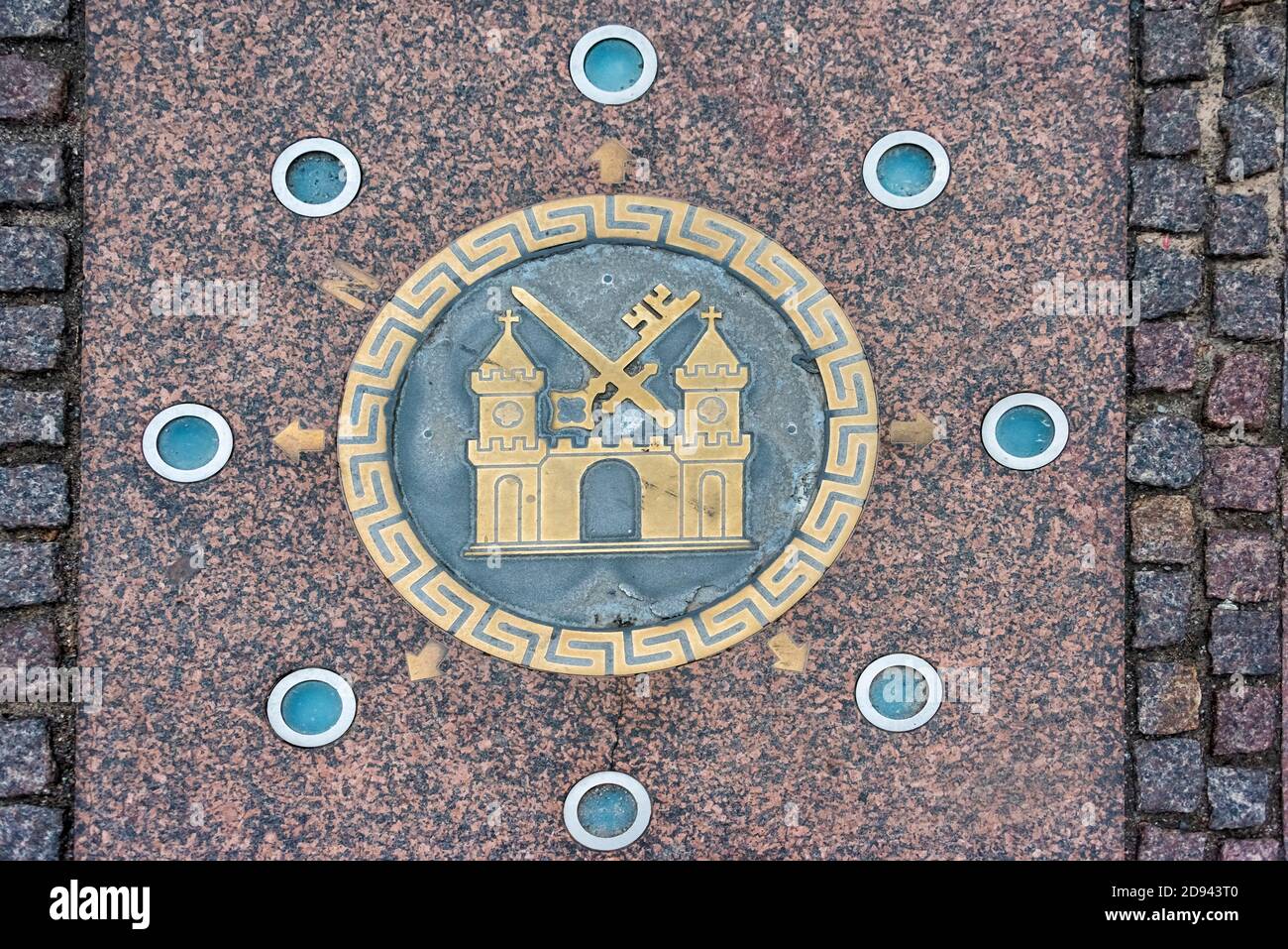 Utility cover decorated with the coat of arms of Tartu in the old town, Tartu, Estonia Stock Photo