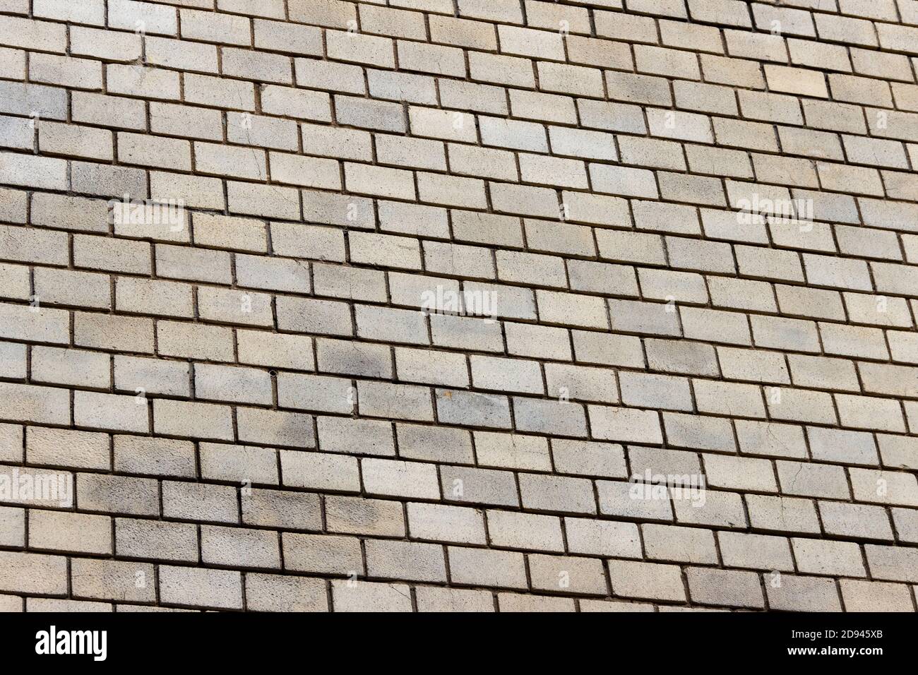 Surface of a yellow brick wall. Stock Photo