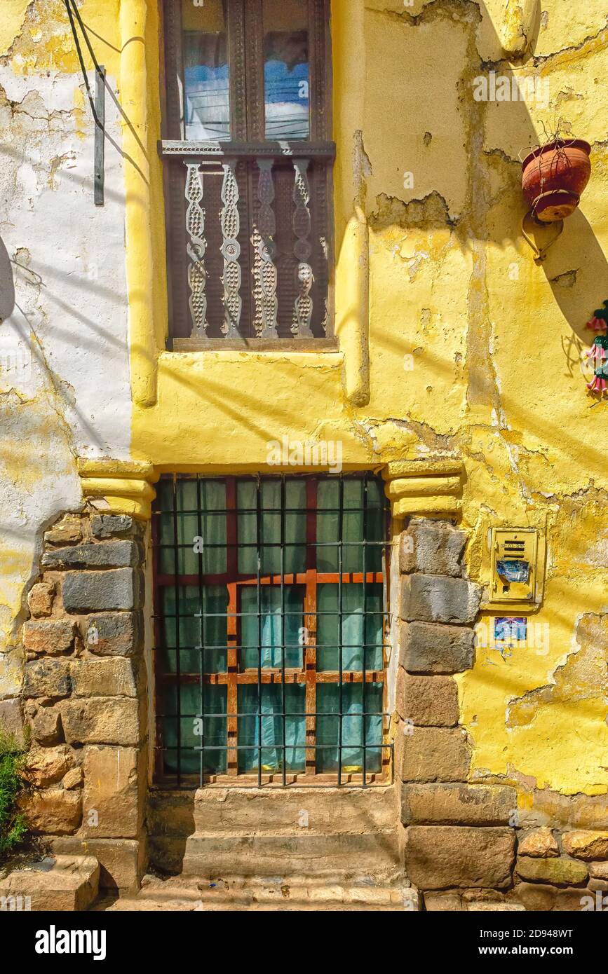 Front of an old delapidated building in Cusco Peru Stock Photo