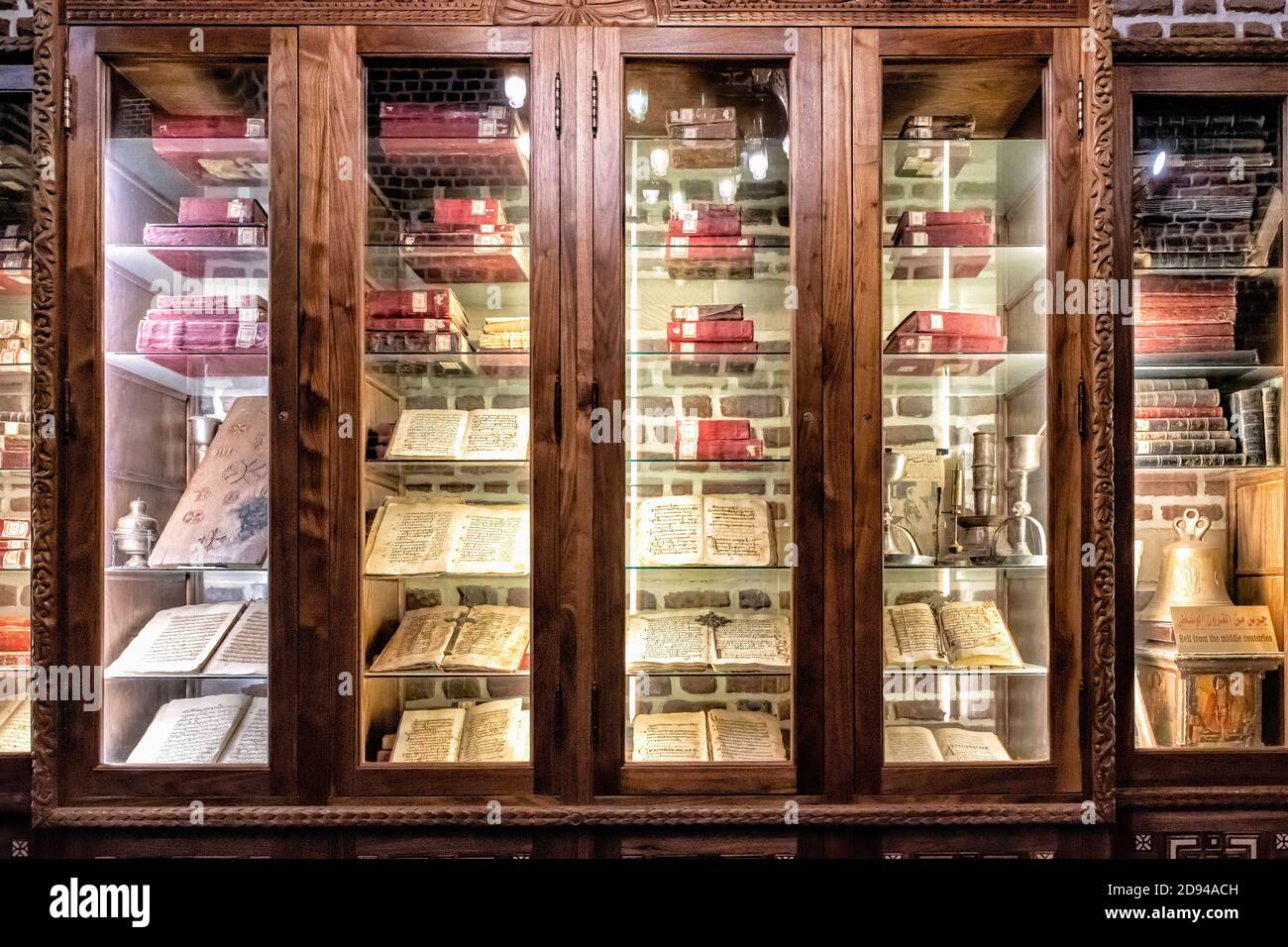 Display of ancient relics, including historic Bibles, in a cabinet at the Saints Sergius and Bacchus Church in Coptic Cairo Stock Photo