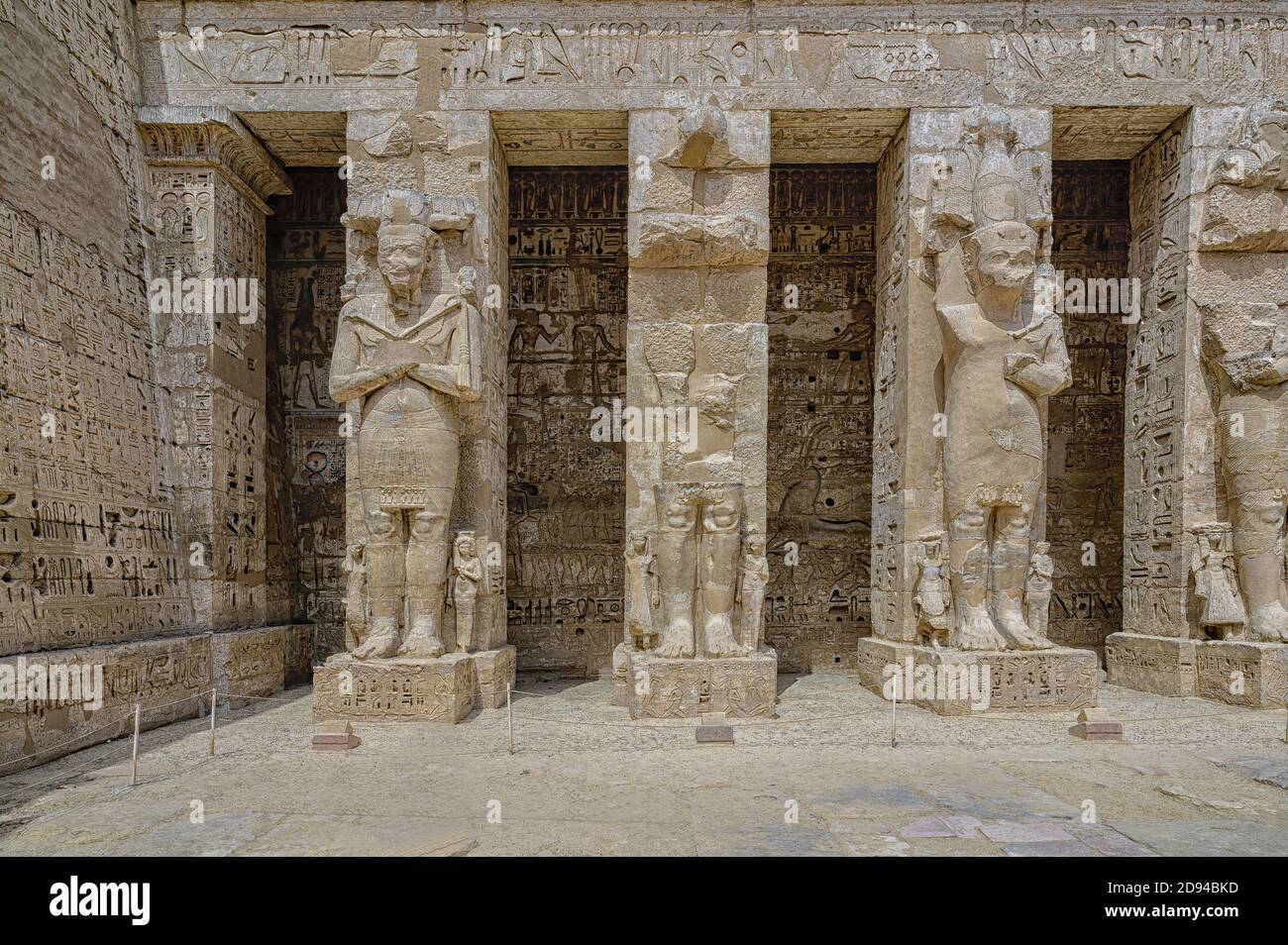 Osiris statues of Ramses III in the first courtyard of Medinet Habu ...