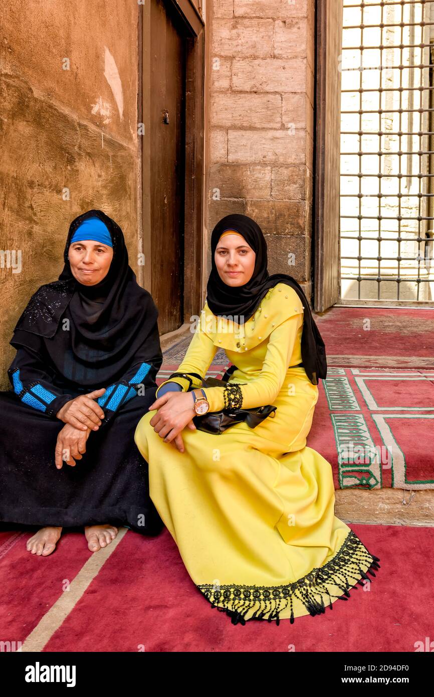 Mother and daughter seated in the Sultan Hassan Mosque, in Cairo, after Friday prayers Stock Photo