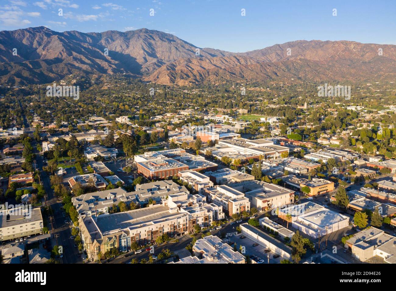 Aerial view above downtown Monrovia California at sunset with San Gabriel Mountains in the distance Stock Photo