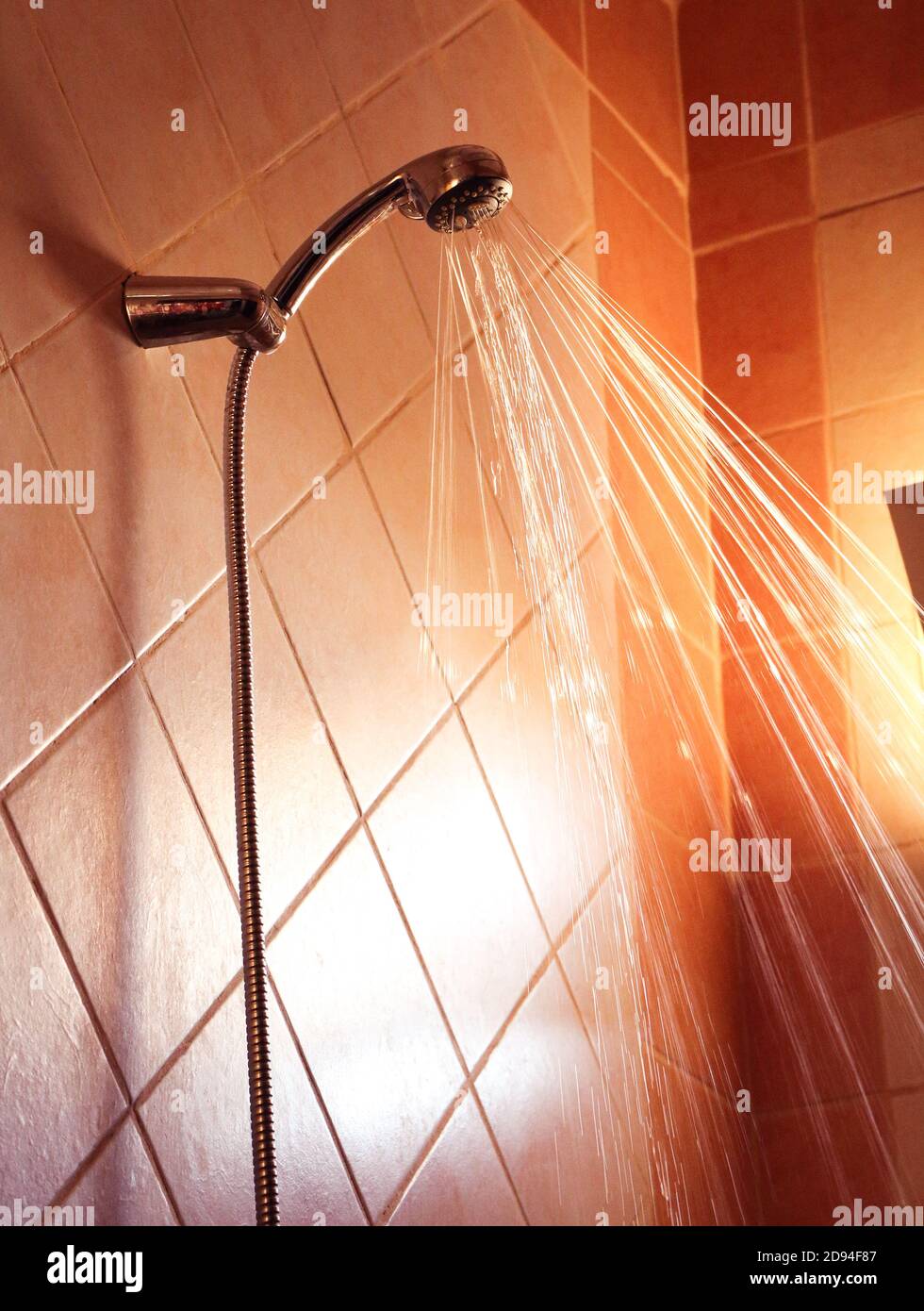 Water flowing from shower faucet in the bathroom interior Stock Photo ...