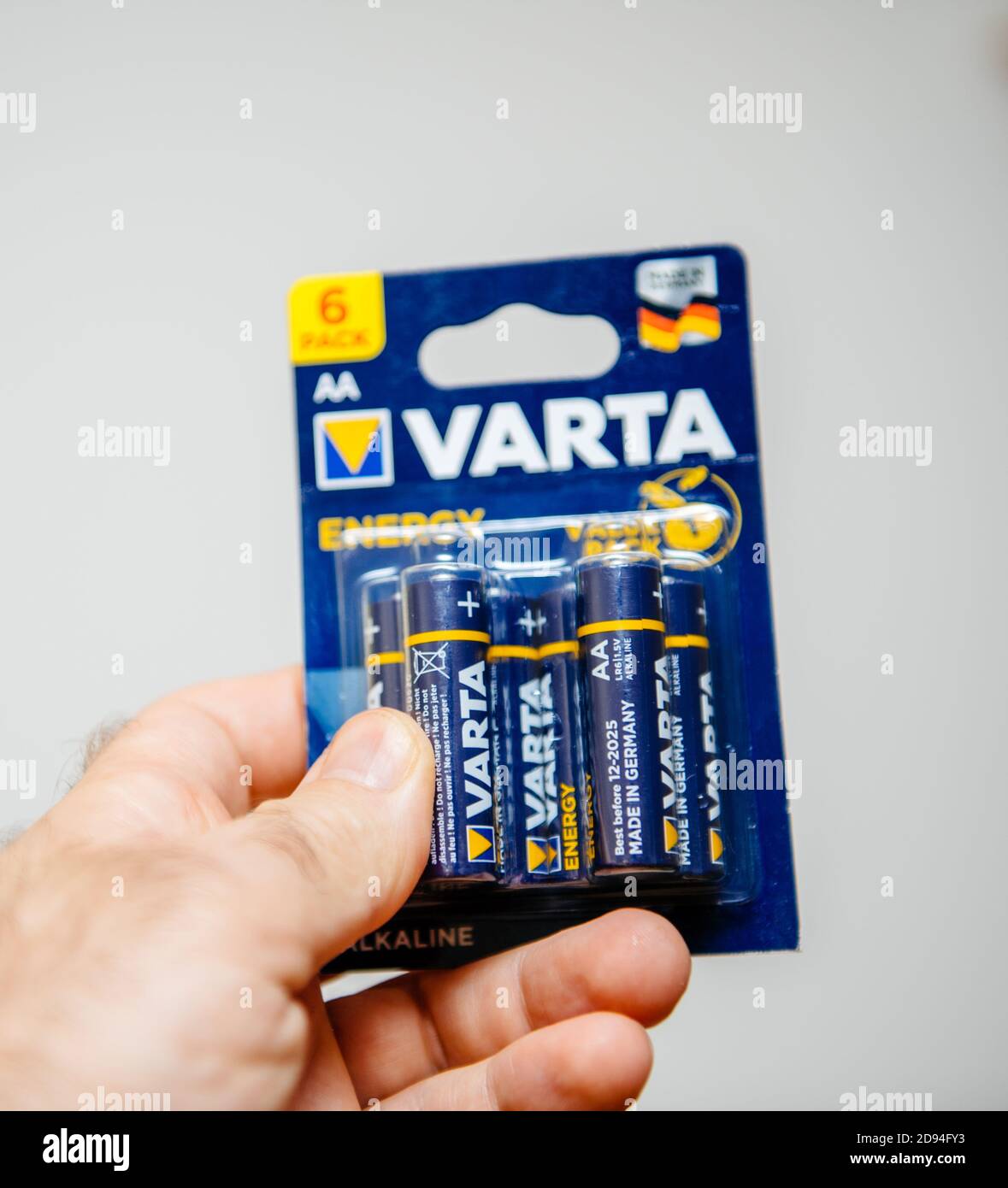 Paris, France - OCt 30, 2020: Male hand POV holding against white  background Varta batteries AA size Stock Photo - Alamy