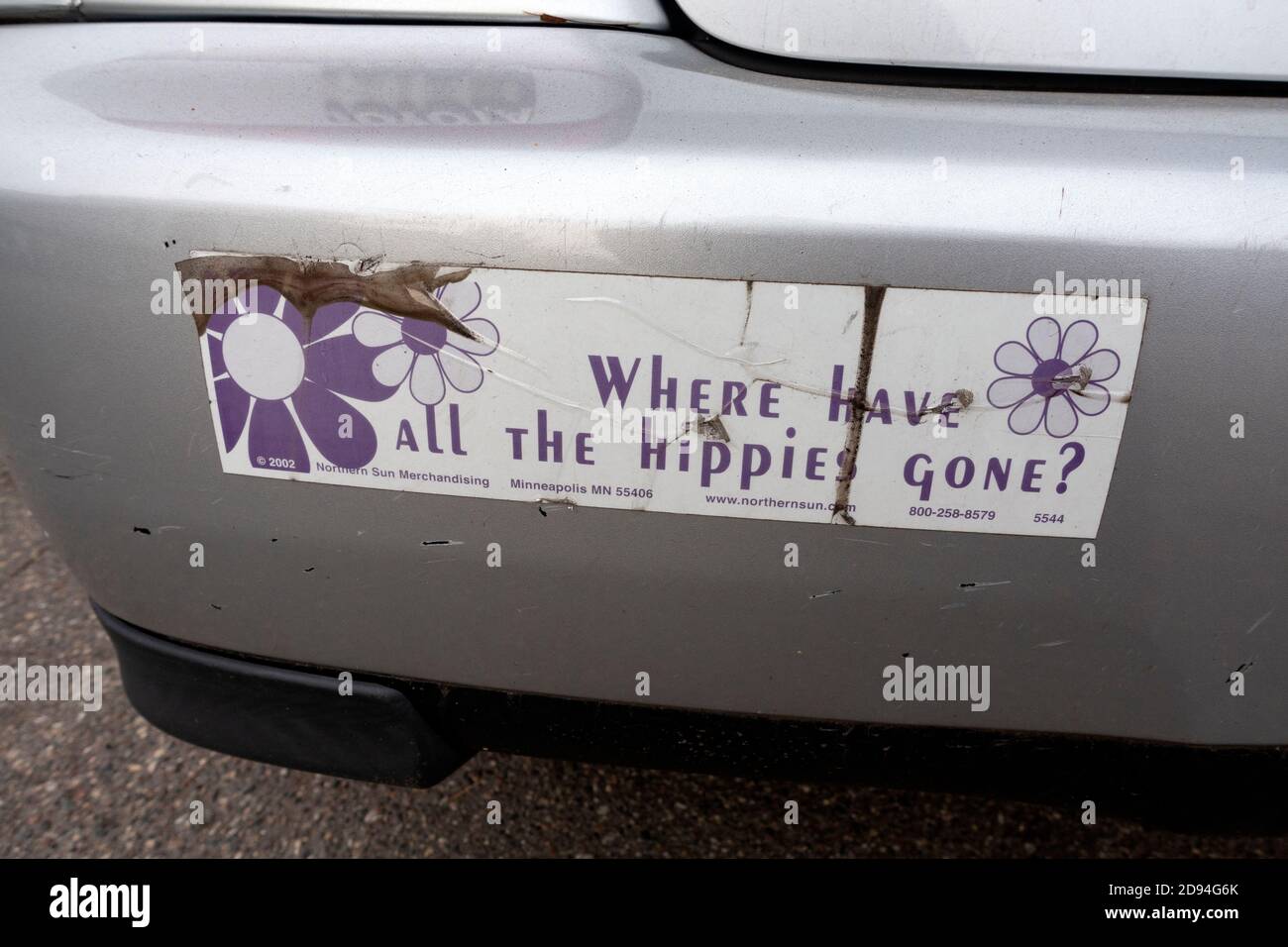 Sign on a car 'Where have all the hippies gone?'. St Paul Minnesota MN USA Stock Photo