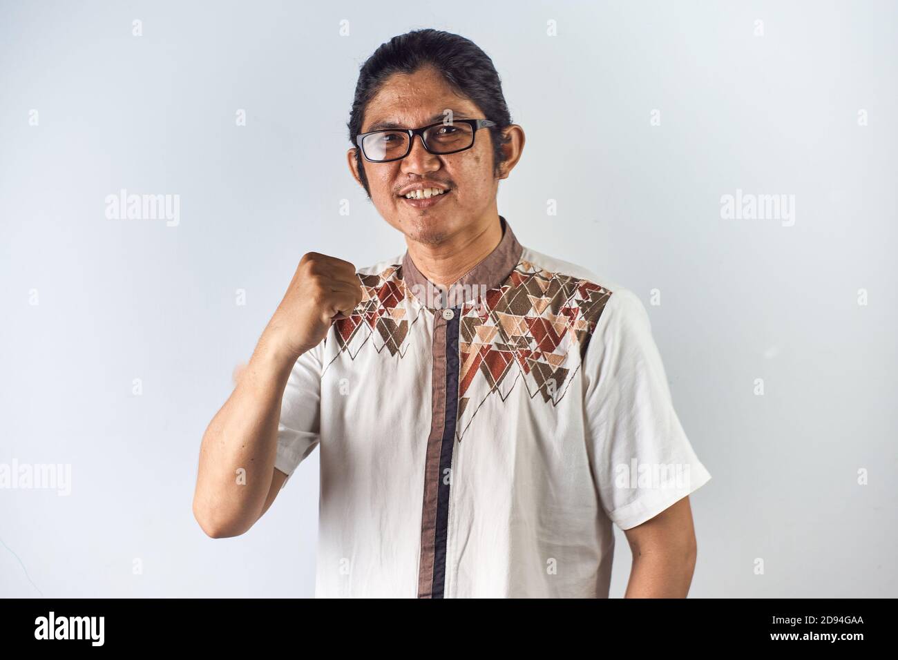 Potrait of asian man with confident, smiling and relaxed pose. on white background Stock Photo