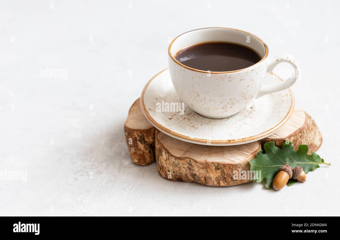 Acorn coffee on a white background. Still life with black coffee, oak