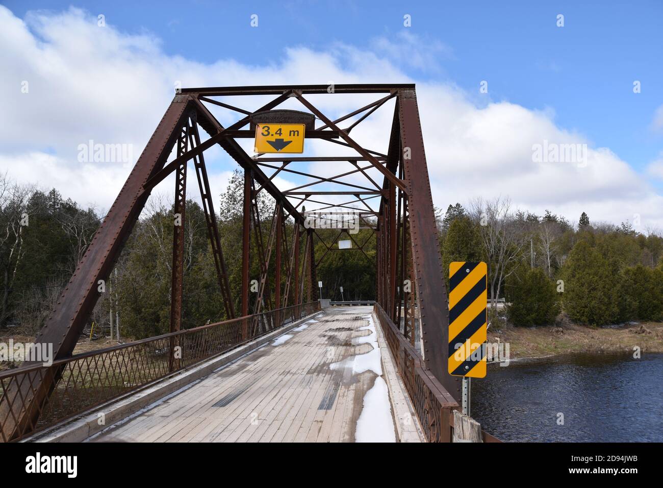 Narrow one-lane bridge in rural Ontario, between Milton and Marsville. Bridge over the Grand River. Picture taken in April of '20, during a drive Stock Photo