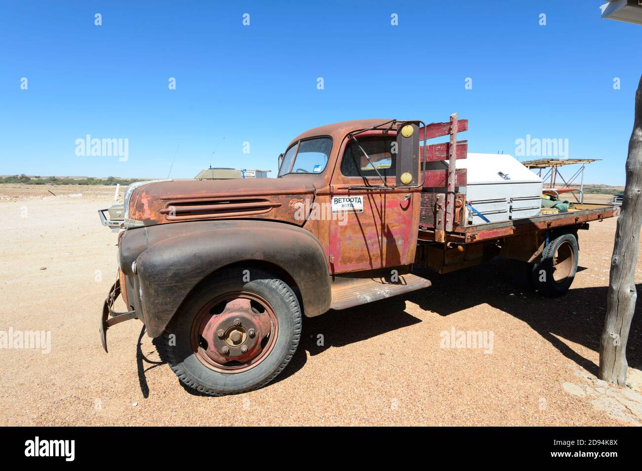 An old rusty Ford truck is part of the memorabilia at the Betoota Hotel, an old renowned Outback pub in the Ghost town of Betoota, Diamantina Shire, Q Stock Photo