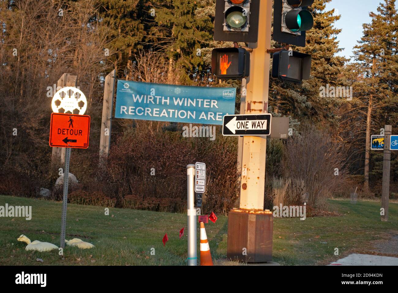 Busy corner with sign for Theodore Wirth city park advertising winter sports in the recreation area. St Paul Minnesota MN USA Stock Photo
