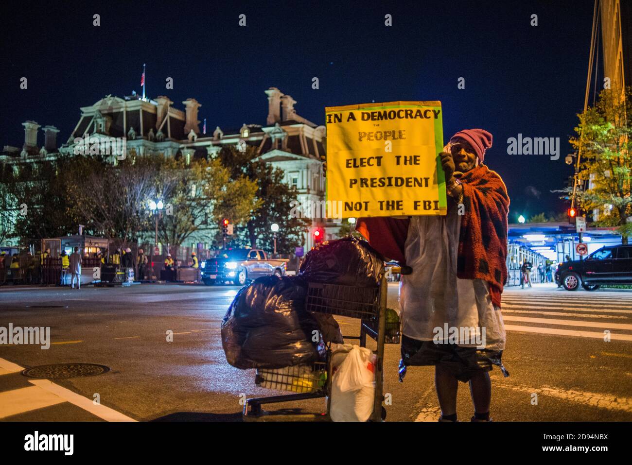 Washington DC USA. 2nd Nov 2020. Senior, Homeless, Black man, holds a sign that reads 'In a Democracy The People Elect The President Not The FBI'. The night before Election 2020.. Washington DC, USA. Yuriy Zahvoyskyy / Alamy Live News. Stock Photo