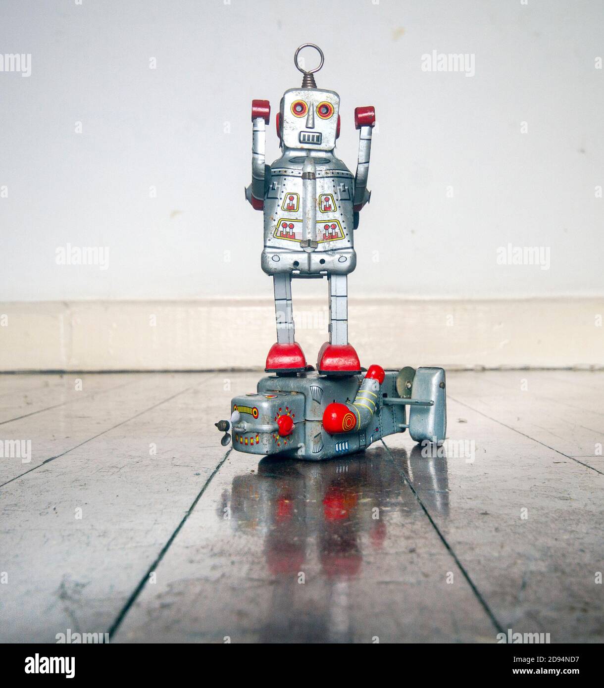 retro silver bot stands on top another silver bot Stock Photo - Alamy