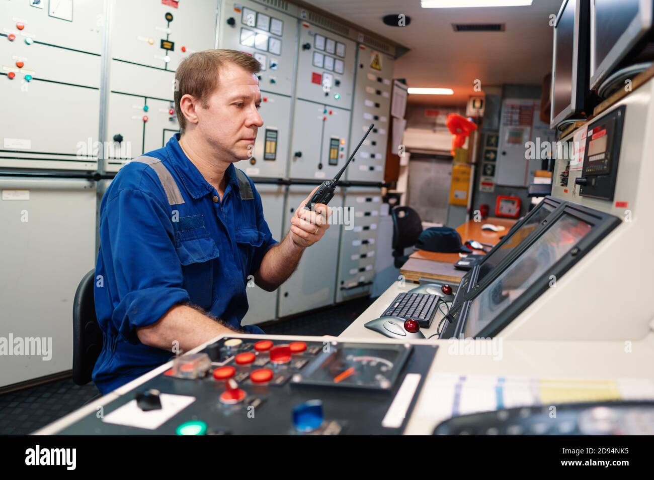 Marine engineer officer controlling vessel engines and propulsion in ...