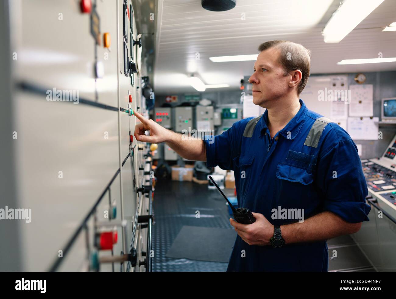 Marine engineer officer controlling vessel engines and propulsion in ...