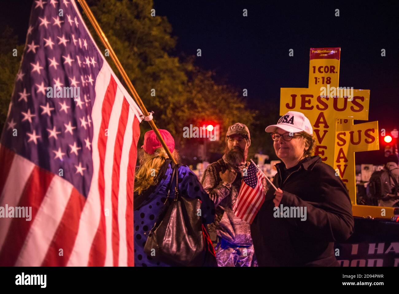 Washington DC, USA, 2nd Nov 2020. Pro America Patriots hold USA flags in support of Trump, amongst activities and other signs, in front of the White House, in the Nation's Capitol,  the night before election day 2020 in USA. Credit: Yuriy Zahvoyskyy / Alamy Live News. Stock Photo