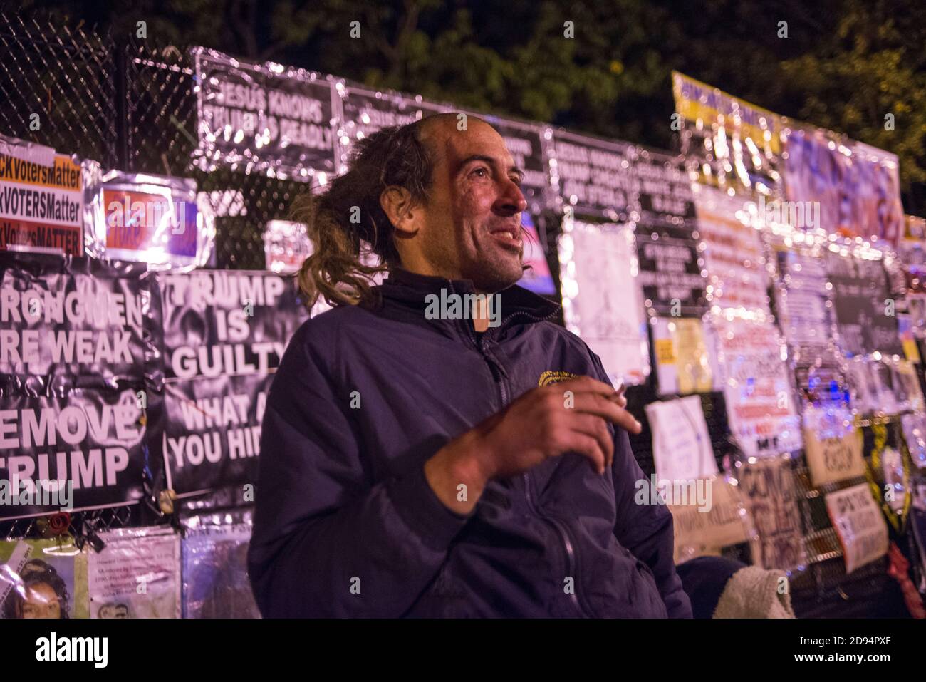 Washington, DC, USA, 2nd Nov 2020. Anti Trump supporter in front of the White House, with anti Trump signs behind him, in the Nation's Capitol. Credit: Yuriy Zahvoyskyy / Alamy Live News. Stock Photo