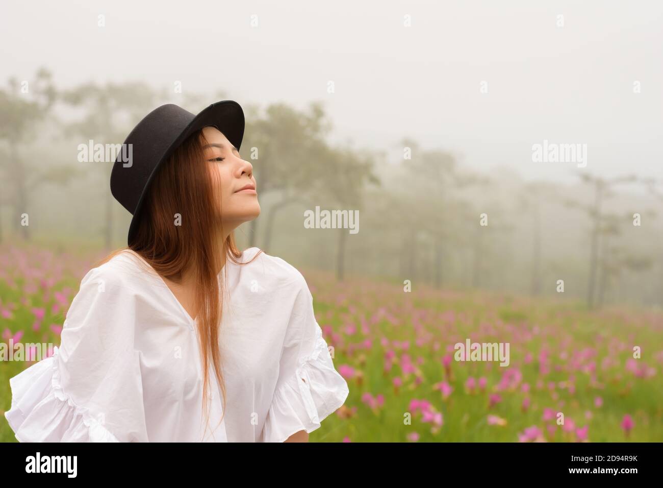 portrait of a woman relaxing in the garden siam tulip Stock Photo - Alamy