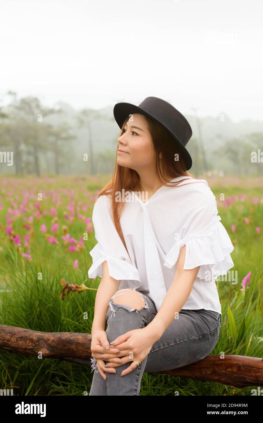 portrait of a woman relaxing in the garden siam tulip Stock Photo - Alamy