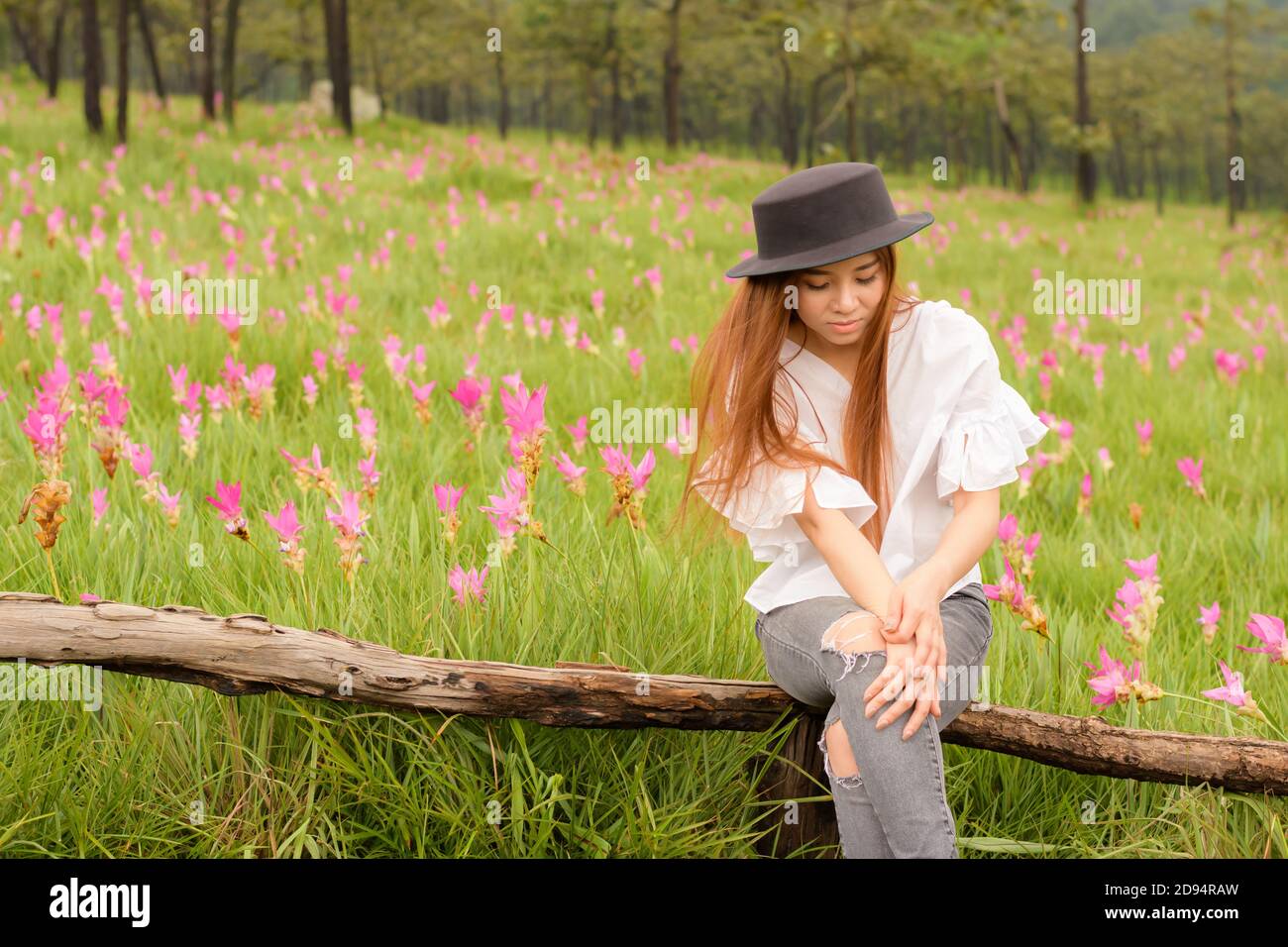 portrait of a woman relaxing in the garden siam tulip Stock Photo - Alamy