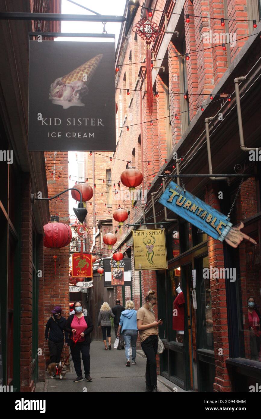 The narrow Fan Tan Alley in the Chinatown district of Victoria, British Columbia Stock Photo