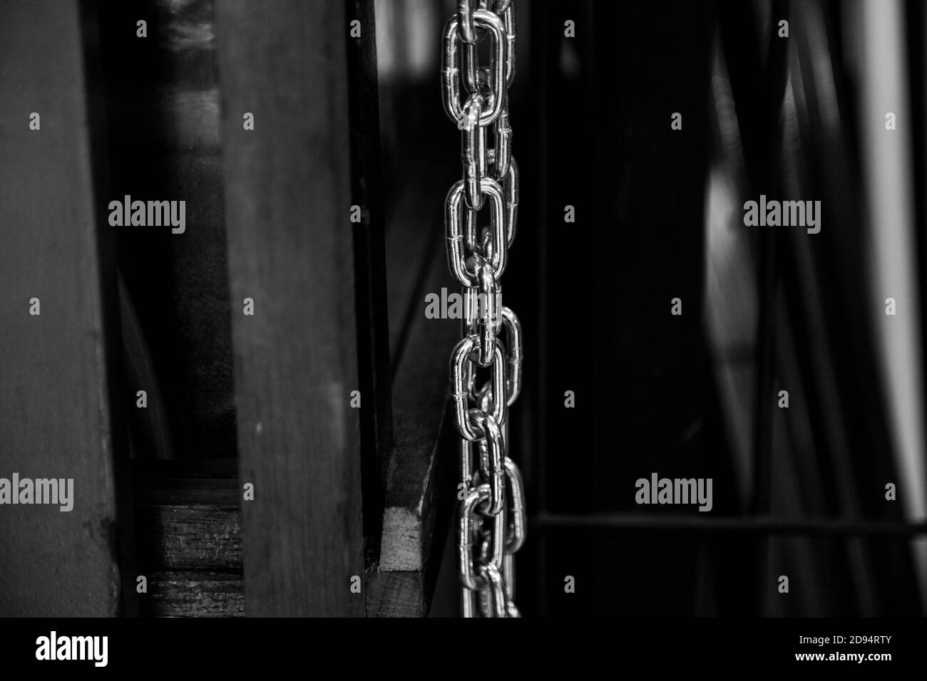 Closeup shot of a chain on dark background Stock Photo