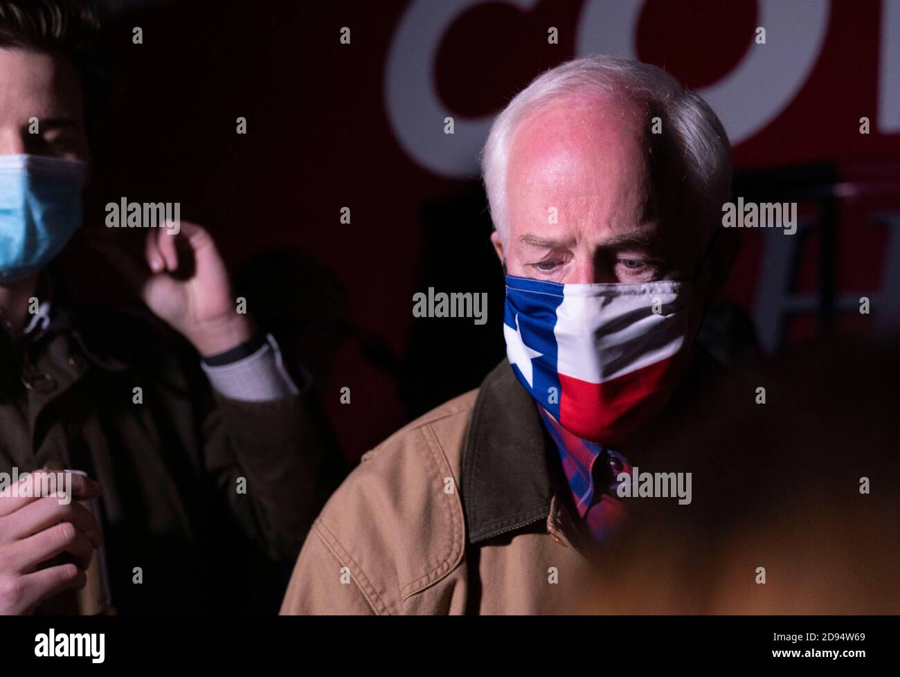 Dripping Springs, Texas, USA. 2nd November, 2020. Republican U.S. Senator John Cornyn wears a Texas flag-themed mask as he arrives at a private ranch to wrap up his campaign for a fourth term in the U.S. Senate. Cornyn is fighting off a challenge from Democrat MJ Hegar, a decorated Army veteran and political novice. Credit: Bob Daemmrich/Alamy Live News Stock Photo