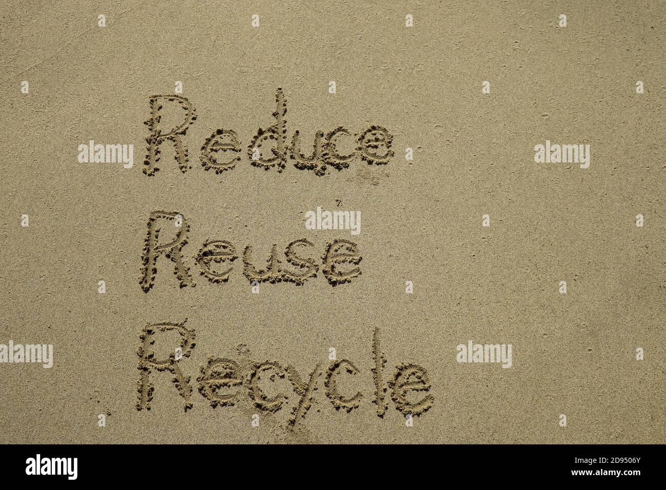 reduce reuse recycle concept drawn on sand, sustainability Stock Photo ...