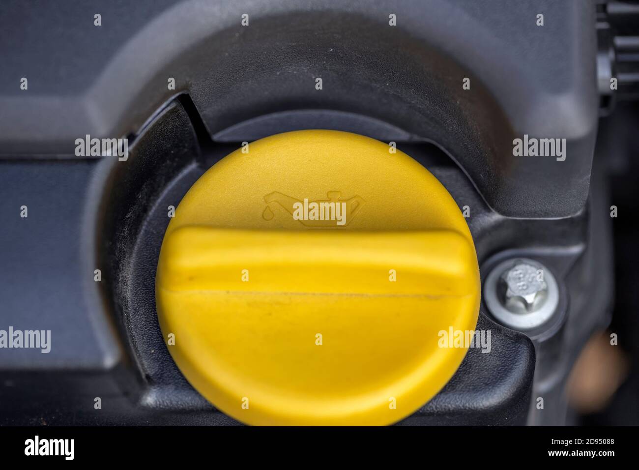 Oil sign on yellow oil cap on the car engine Stock Photo Alamy