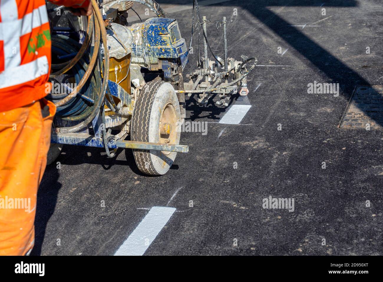 Spray road marking machine on the street during road construction works Stock Photo Alamy
