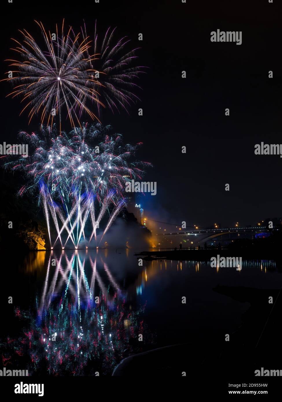 Dusk view of the Bitan Suspension Bridge with fireworks at Xindian ...