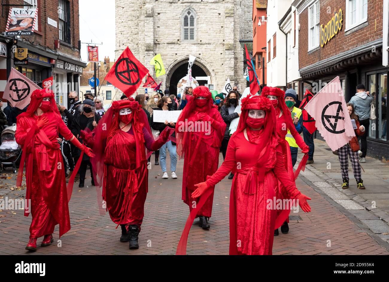 Canterbury, UK. 31st October 2020. Extinction Rebellion Procession led by the Red Rebels via Westgate Towers through the centre of Canterbury along the pedestrianised High Street. A new Day of the Dead spectacle in the city involving music, skeletal animals, and the mourning and solace of the Red Rebels. XR say there is a need to call on the government and institutions to Tell The Truth about the climate and ecological crises that we are in and Act Now and get behind the CEE bill. Hosted by Extinction Rebellion Canterbury and Extinction Rebellion Southeast UK. Credit: Stephen Bell/Alamy Stock Photo